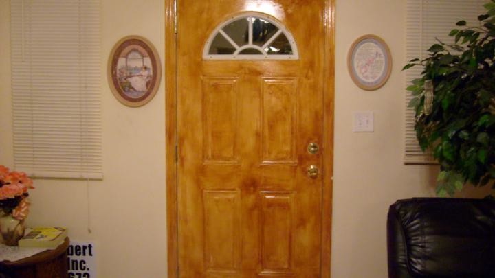 Residential Metal door grained to look like wood Tampa